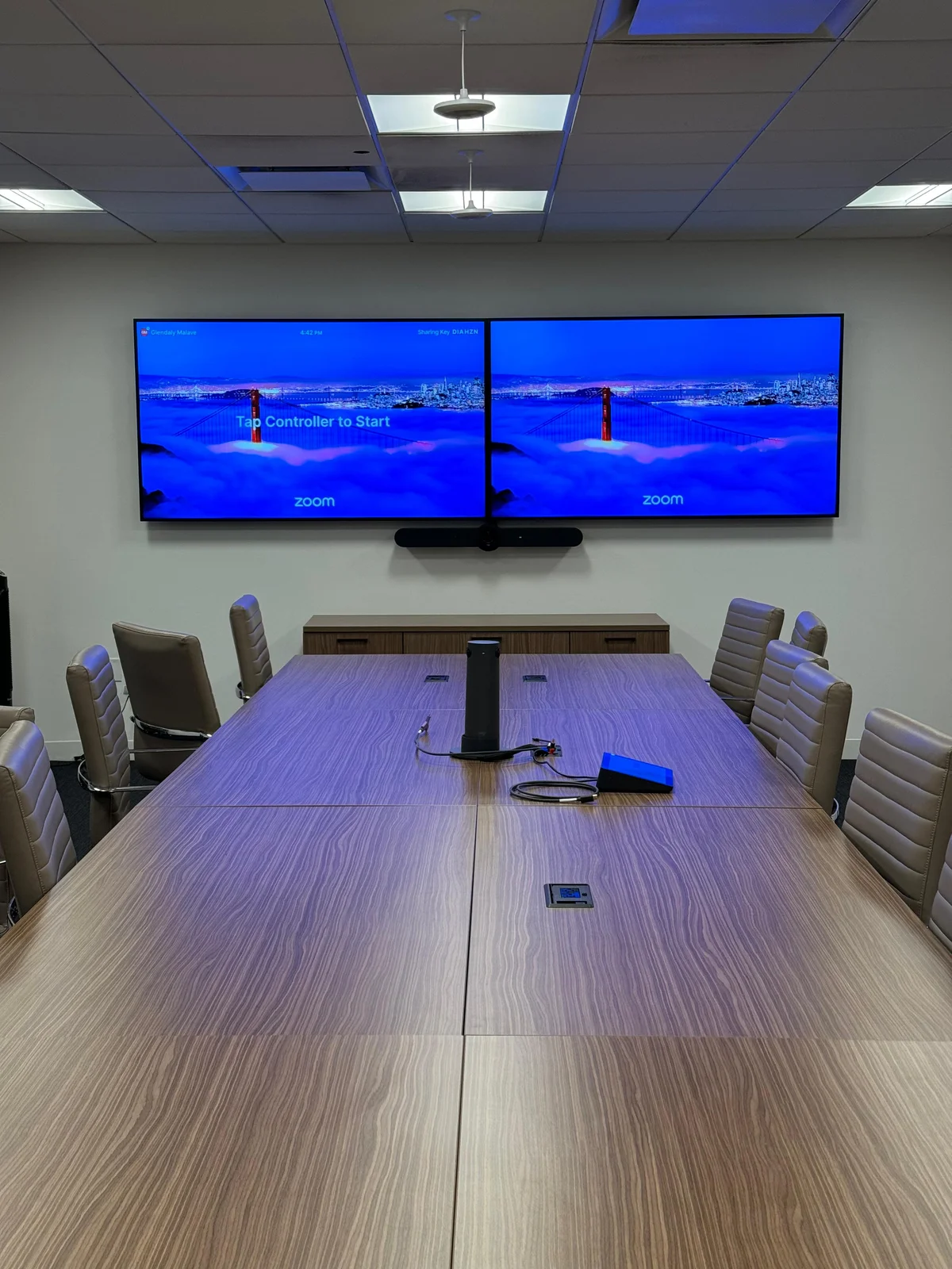 Dual Zoom displays in corporate boardroom