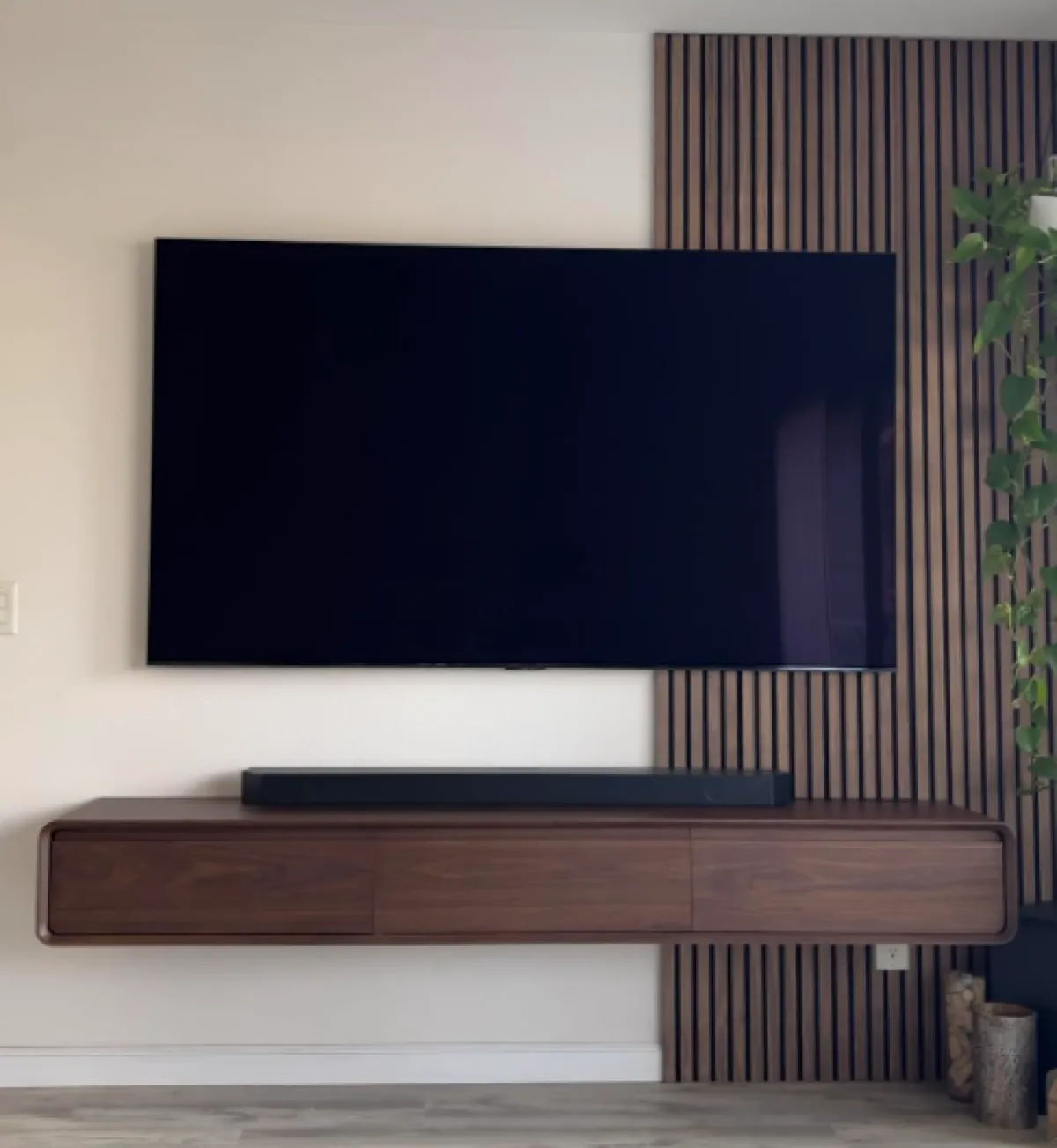 TV with floating stand and LED underlight in living room