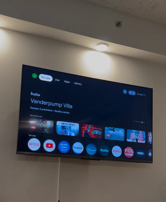 Wall-mounted TV with hidden cables