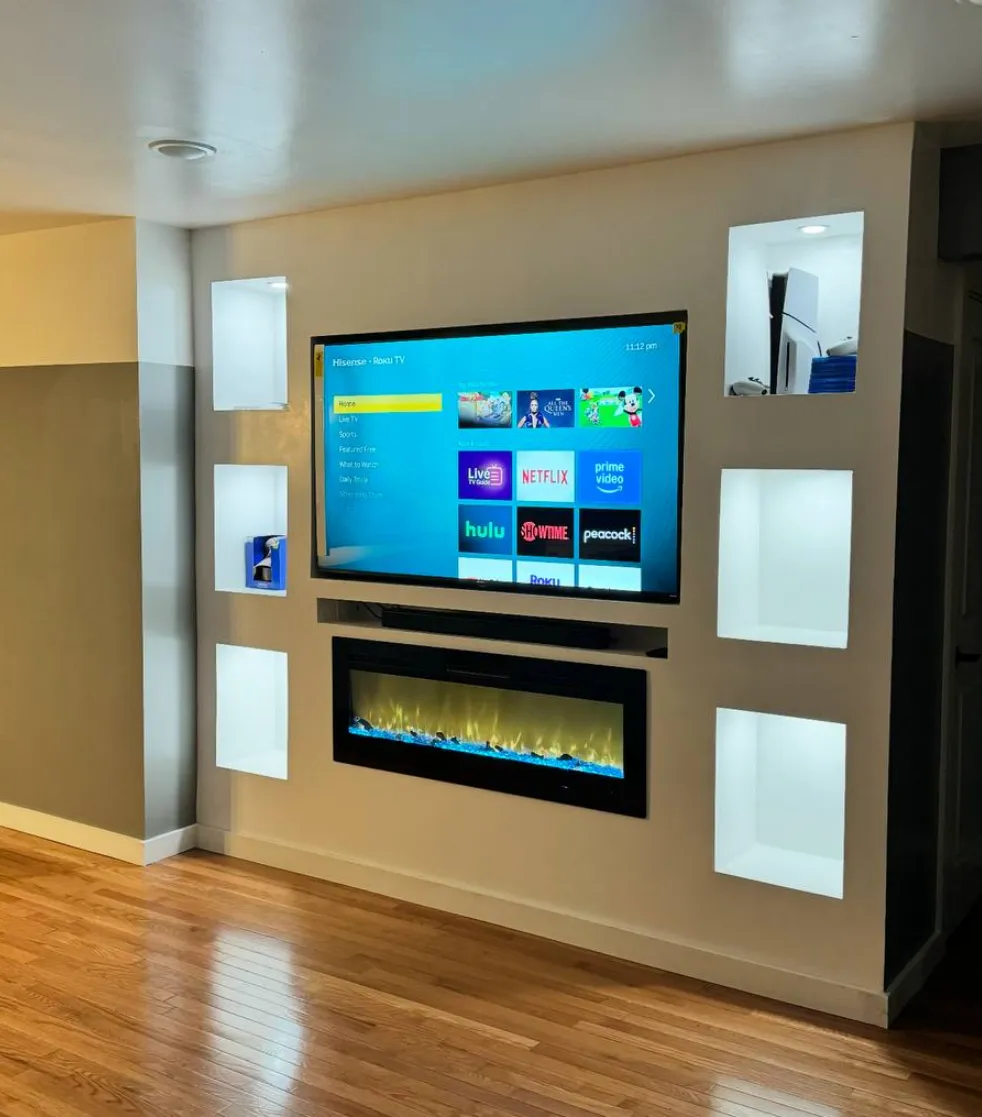 Custom media wall with fireplace and LED niches
