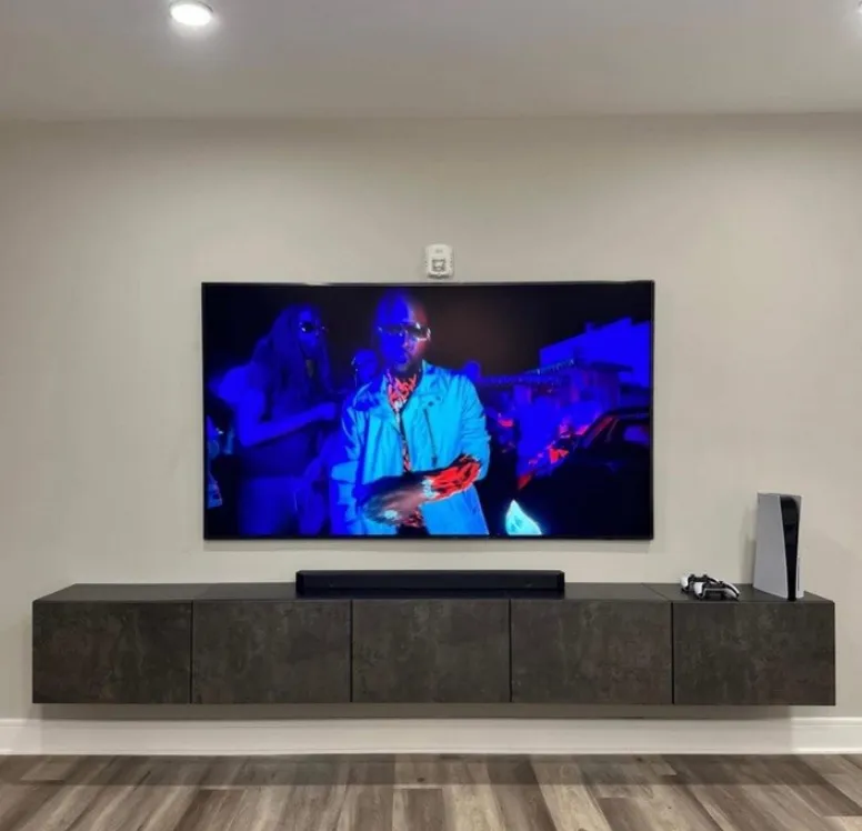 Floating console with mounted TV setup